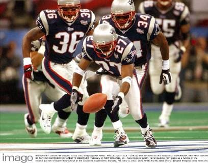 Feb. 3, 2002 - U.S. - (KRT2) KRT SPORTS STORY SLUGGED: SUPERBOWL KRT PHOTOGRAPH BY PATRICK SCHNEIDER CHARLOTTE OBSERVER (February 3) NEW ORLEANS, LA - New England safety Terrel Buckley (27) picks up a fumble in the second quarter of Super Bowl XXXVI at the Louisiana Superdome, Sunday, February 3, 2002. (CH) AP NC KD BL 2002 (Horiz) (Digital image) (smd) News Archive - Feb. 3, 2002 - ZUMAm67