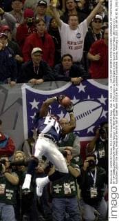 Feb. 3, 2002 - U.S. - (KRT3) KRT SPORTS STORY SLUGGED: SUPERBOWL KRT PHOTOGRAPH BY TIM ISBELL BILOXI SUN HERALD(February 3) NEW ORLEANS, LA - A fan cheers as New England wide receiver David Patten (86) hauls in a touchdown catch in the closing minutes of the first half of Super Bowl XXXVI at the Louisiana Superdome, Sunday, February 3, 2002. (BI) AP NC KD BL 2002 (Vert) (Digital image) (smd) News Archive - Feb. 3, 2002 - ZUMAm67