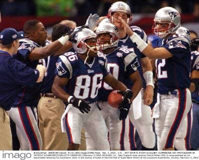Feb. 3, 2002 - U.S. - KRT SPORTS STORY SLUGGED: SUPERBOWL KRT PHOTOGRAPH BY PATRICK SCHNEIDER CHARLOTTE OBSERVER (February 3) NEW ORLEANS, LA - New England wide receiver David Patten (86) is congratulated by his teammates following his touchdown catch in the closing minutes of the first half of Super Bowl XXXVI at the Louisiana Superdome, Sunday, February 3, 2002. (CH) NC KD BL 2002 (Vert) (Digital image) (smd) News Archive - Feb. 3, 2002 - ZUMAm67