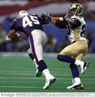 Feb. 3, 2002 - U.S. - KRT SPORTS STORY SLUGGED: SUPERBOWL KRT PHOTOGRAPH BY JOE LEDFORD KANSAS CITY STAR (February 3) NEW ORLEANS, LA - New England s Jeff Robinson (45) fights to get away from St. Louis wide reciever Torry Holt (88) after Robinson intercepted a pass in the third quarter of Super Bowl XXXVI at the Louisiana Superdome, Sunday, February 3, 2002. (KC) NC KD BL 2002 (Vert) (Digital image) (smd) News Archive - Feb. 3, 2002 - ZUMAm67
