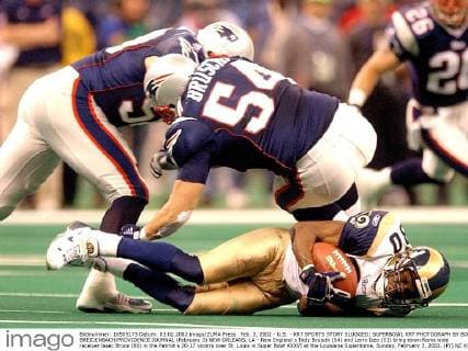 Feb. 3, 2002 - U.S. - KRT SPORTS STORY SLUGGED: SUPERBOWL KRT PHOTOGRAPH BY BOB BREIDENBACH PROVIDENCE JOURNAL (February 3) NEW ORLEANS, LA - New England s Tedy Bruschi (54) and Larry Izzo (53) bring down Rams wide receiver Issac Bruce (80) in the Patriot s 20-17 vicotry over St. Louis in Super Bowl XXXVI at the Louisiana Superdome, Sunday, February 3, 2002. (PJ) NC KD BL 2002 (Horiz) (Digital image) (smd) -- NO MAGS, NO SALES News Archive - Feb. 3, 2002 - ZUMAm67
