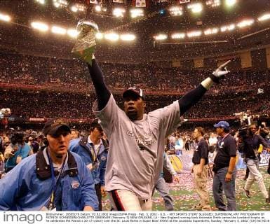 Feb. 3, 2002 - U.S. - KRT SPORTS STORY SLUGGED: SUPERBOWL KRT PHOTOGRAPH BY PATRICK SCHNEIDER CHARLOTTE OBSERVER (February 3) NEW ORLEANS, LA - New England running back Antowain Smith caries the Lombardi trophy as he celebrates the Patriot s 20-17 victory over the St. Louis Rams in Super Bowl XXXVI at the Louisiana Superdome, Sunday, February 3, 2002. (CH) NC KD BL 2002 (Vert) (Digital image) (smd) News Archive - Feb. 3, 2002 - ZUMAm67