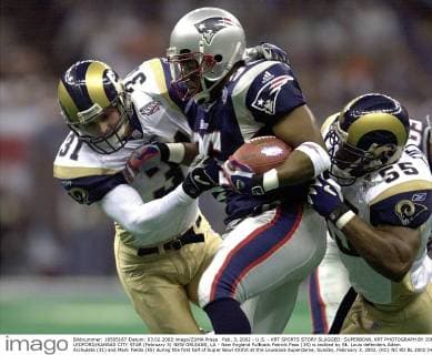 Feb. 3, 2002 - U.S. - KRT SPORTS STORY SLUGGED: SUPERBOWL KRT PHOTOGRAPH BY JOE LEDFORD KANSAS CITY STAR (February 3) NEW ORLEANS, LA - New England Fullback Patrick Pass (35) is tackled by St. Louis defenders Adam Archuleta (31) and Mark Fields (55) during the first half of Super Bowl XXXVI at the Louisiana Superdome, Sunday, February 3, 2002. (KC) NC KD BL 2002 (Horiz) (Digital image) (smd) News Archive - Feb. 3, 2002 - ZUMAm67