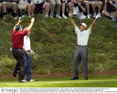 April 7, 2004 - U.S. - Tiger Woods celebrates his hole-in-one with Mark O Meara (red shirt) and Arnold Palmer on the 9th hole of the annual Par 3 Contest that was held on the final day of practice for the Masters golf tournament at the Augusta National Golf Club in Augusta, GA., Wednesday, April 7, 2004. (Photo by Erik Campos News Archive - April 7, 2004 - ZUMAm67