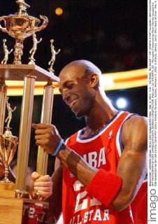 Feb. 9, 2003 - U.S. - NO MAGS, NO SALES -- KRT SPORTS STORY SLUGGED: BKN-ALLSTARS KRT PHOTOGRAPH BY JOEY IVANSCO ATLANTA JOURNAL-CONSTITUTION (February 10) ATLANTA, GA - Minnesota Timberwolves Kevin Garnett accepts the NBA Basketball Herren USA All-Star Game MVP trophy following the game, Sunday, February 9, 2003, in Atlanta, Georgia. (smd) 2003 News Archive - Feb. 9, 2003 - ZUMAm67