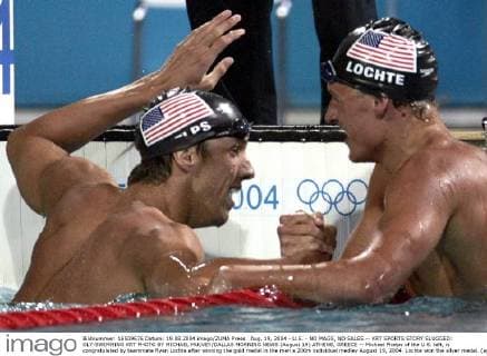 Aug. 19, 2004 - U.S. - NO MAGS, NO SALES -- KRT SPORTS STORY SLUGGED: OLY-SWIMMING KRT PHOTO BY MICHAEL MULVEY DALLAS MORNING NEWS (August 19) ATHENS, GREECE -- Michael Phelps of the U.S. left, is congratulated by teammate Ryan Lochte after winning the gold medal in the men s 200m individual medley August 19, 2004. Lochte won the silver medal. (ag) 2004 News Archive - Aug. 19, 2004 - ZUMAm67