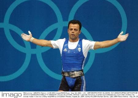 Aug. 14, 2004 - U.S. - KRT SPORTS STORY SLUGGED: OLY-WEIGHTLIFTING KRT PHOTO BY PATRICK SCHNEIDER CHARLOTTE OBSERVER (August 16) ATHENS, GREECE -- Leonidas Sampanis of Greece acknowledges the crowd after clinching the bronze medal in the men s 62kg weightlifting competition Monday, August 16, 2004, during the 2004 Olympic Games. (gsb) 2004 News Archive - Aug. 14, 2004 - ZUMAm67