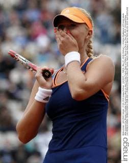 (140527) -- PARIS, May 27, 2014 (Xinhua) -- Kristina Mladenovic of France reacts after winning the Women s Singles first round match on day 3 of the French Open at Roland Garros in Paris on May 27, 2014. (Xinhua Wang Lili) FRANCE-PARIS-TENNIS-FRENCH OPEN-DAY 3 