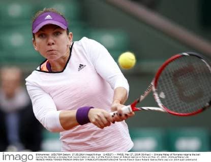 (140527) -- PARIS, May 27, 2014 (Xinhua) -- Simona Halep of Romania returns the ball during the Women s Singles first round match on day 3 of the French Open at Roland Garros in Paris on May 27, 2014. (Xinhua Wang Lili) FRANCE-PARIS-TENNIS-FRENCH OPEN-DAY 3 