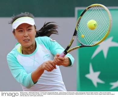 Shuai Peng of China hits a shot during her French Open women s first round match at Roland Garros in Paris on May 27, 2014.  PAR20140527731