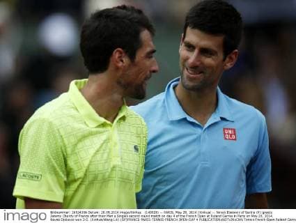 (140528) -- PARIS, May 28, 2014 (Xinhua) -- Novak Djokovic of Serbia (R) greets Jeremy Chardy of France after their Men s Singles second round match on day 4 of the French Open at Roland Garros in Paris on May 28, 2014. Novak Djokovic won 3-0. (Xinhua Wang Lili) (SP)FRANCE-PARIS-TENNIS-FRENCH OPEN-DAY 4 