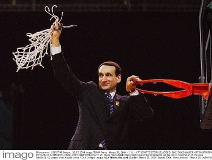 March 28, 2004 - U.S. - KRT SPORTS STORY SLUGGED: BKC-DUKE-XAVIER KRT PHOTOGRAPH BY PATRICK SCHNEIDER CHARLOTTE OBSERVER (March 28) Duke men s basketball coach Mike Krzyzewski holds up the net in celebration of the Blue Devils 66-62 victory over Xavier in the NCAA College League USA Atlanta Regional, Sunday, March 28, 2004. (smd) 2004. News Archive - March 28, 2004 - ZUMAm67