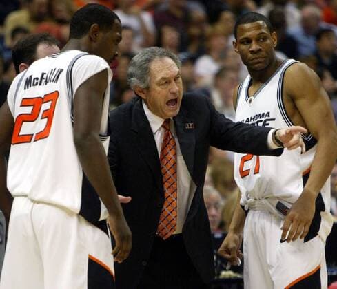 April 3, 2004 - U.S. - NO MAGS, NO SALES -- KRT SPORTS STORY SLUGGED: BKC-OKLAHOMAST-GATECH KRT PHOTOGRAPH BY MICHAEL MULVEY DALLAS MORNING NEWS (April 3) SAN ANTONIO, TX - Oklahoma State coach Eddie Sutton speaks to players Ivan McFarlin (23) and Stephen Graham (21) during the first half the NCAA College League USA Final Four semifinal game between the Georgia Tech Yellow Jackets and Cowboys at the Alamodome, in San Antonio, Texas, Saturday, April 3, 2004. (smd) 2004 News Archive - April 3, 2004 - ZUMAm67
