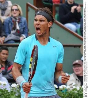 Rafael Nadal of Spain reacts after a shot during his French Open men s second round match at Roland Garros in Paris on May 29, 2014.  PAR20140529737
