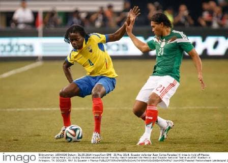 31 May 2014: Ecuador defender Juan Carlos Paredes (4) tries to hold off Mexico midfielder Carlos Pena (21) during the international soccer friendly match between the Mexico and Ecuador National Teams at AT&T Stadium in Arlington, TX. SOCCER: MAY 31 Ecuador v Mexico Icon0483 EDITORIAL USE ONLY