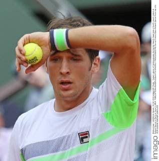 Dusan Lajovic of Serbia pauses during his French Open men s fourth round match at Roland Garros in Paris on June 2, 2014.  PAR20140602742