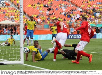 England s Wayne Rooney scoring his sides opening goal after Rickie Lambert hits the post England v Ecuador - International Friendly - Sun Life Stadium- Miami - USA - 04 06 2014 - Pic David Klein Sportimage EDITORIAL USE ONLY. No use with unauthorised audio, video, data, fixture lists, club league logos or live services. Online in-match use limited to 120 images, no video emulation. No use in betting, games or single club league player publications.