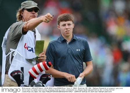 June 12, 2014 - Pinehurst, NC, USA - Matthew Fitzpatrick, an amateur, gets some advice from his caddie Lorne Duncan, Thursday June 12, 2014, in Pinehurst, N.C. Players began play at Pinehurst No. 2 during the first round of the U.S. Open. U.S. Open - ZUMAm67