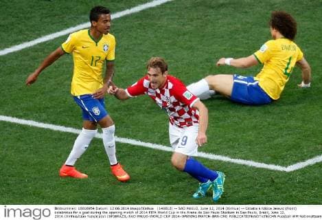 (140612) -- SAO PAULO, June 12, 2014 (Xinhua) -- Croatia s Nikica Jelavic (front) celebrates for a goal during the opening match of 2014 FIFA World Cup in the Arena de Sao Paulo Stadium in Sao Paulo, Brazil, June 12, 2014.(Xinhua Liao Yujie)(pcy) (SP)BRAZIL-SAO PAULO-WORLD CUP 2014-OPENING MATCH-BRA-CRO 