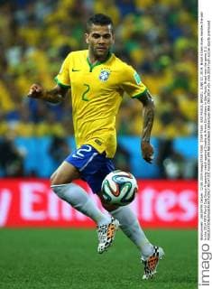 ITAR-TASS: SAO PAULO, BRAZIL. JUNE 12, 2014. Brazil s Dani Alves handles the ball in the 2014 FIFA World Cup Group A opening match against Croatia at Arena Corinthians in Sao Paulo. Brazil won the game 3:1.  RE14720C