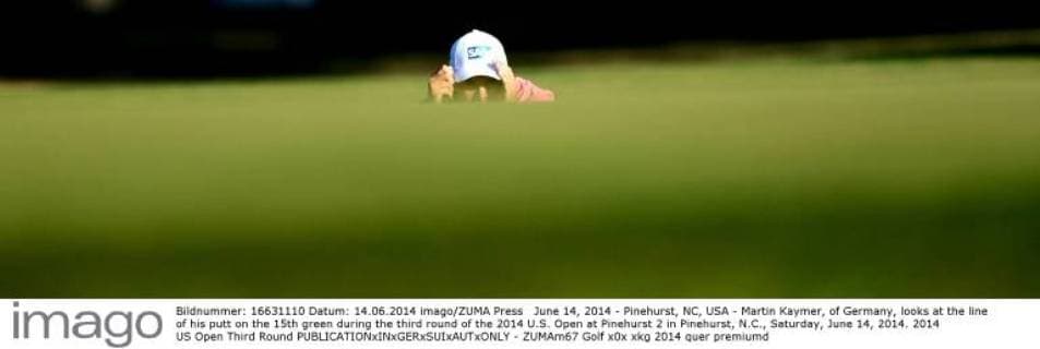 June 14, 2014 - Pinehurst, NC, USA - Martin Kaymer, of Germany, looks at the line of his putt on the 15th green during the third round of the 2014 U.S. Open at Pinehurst 2 in Pinehurst, N.C., Saturday, June 14, 2014. 2014 US Open Third Round - ZUMAm67