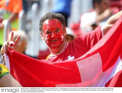 A Switzerland s fan cheers for his team before a Group E match of 2014 FIFA World Cup at the Estadio Nacional Stadium in Brasilia, June 15, 2014. 