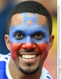 A French Fan poses before a Group E match of 2014 FIFA World Cup at the Estadio Beira-Rio Stadium in Porto Alegre, June 15, 2014. 