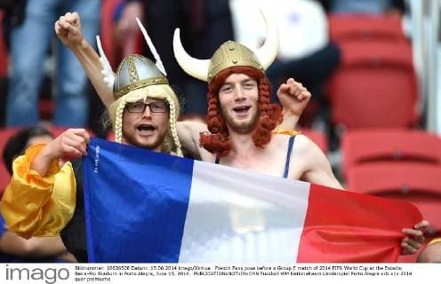 French Fans pose before a Group E match of 2014 FIFA World Cup at the Estadio Beira-Rio Stadium in Porto Alegre, June 15, 2014. 