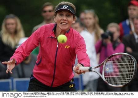 ITAR-TASS: MOSCOW, RUSSIA. JUNE 12, 2014. US Monica Seles returns a shot during Tennis Legends Moscow 2014 tournament at Juan Antonio Samaranch National Tennis Centre.  RE1471D3