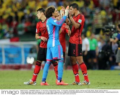 17.06.2014. Fortaleza, Brazil. World Cup finals 2014. Brazil versus Mexico. Ochoa celebrates with Rodriguez at end of the match xPaoloxNuccix  ActionPlus20203276