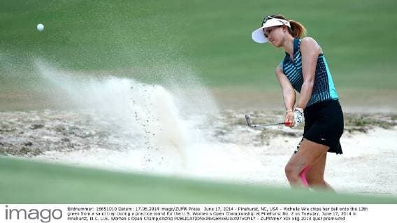 June 17, 2014 - Pinehurst, NC, USA - Michelle Wie chips her ball onto the 13th green from a sand trap during a practice round for the U.S. Women s Open Championship at Pinehurst No. 2 on Tuesday, June 17, 2014 in Pinehurst, N.C. U.S. Women s Open Championship - ZUMAm67