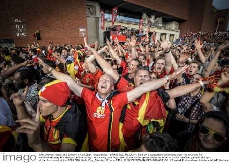 BRUSSELS, BELGIUM: Belgium s supporters celebrates near the Brussels Roi Baudouin-Koning Boudewijn stadium during the viewing on a big screen of the soccer game played in Belo Horizonte, the first game in Group H of the first round of the 2014 FIFA World Cup, Tuesday 17 June 2014. 