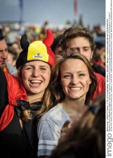 BRUSSELS, BELGIUM: Belgium s supporters celebrate near the Brussels Roi Baudouin-Koning Boudewijn stadium during the viewing on a big screen of the soccer game played in Belo Horizonte, the first game in Group H of the first round of the 2014 FIFA World Cup, Tuesday 17 June 2014. 