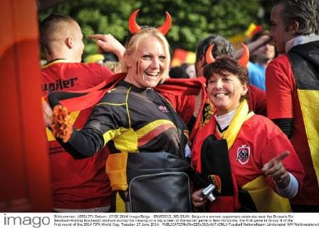 BRUSSELS, BELGIUM: Belgium s women supporters celebrate near the Brussels Roi Baudouin-Koning Boudewijn stadium during the viewing on a big screen of the soccer game in Belo Horizonte, the first game in Group H of the first round of the 2014 FIFA World Cup, Tuesday 17 June 2014. 