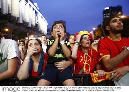 Madrid, Spain - Spanish fans react during the World Cup soccer match, in Madrid, Spain, Wednesday, June 18, 2014. Spain is out of World Cup 20114. The reaction of the spanish in Madrid  - ZUMAn23