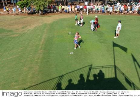 June 19, 2014 - Pinehurst, NC, USA - Eleven-year-old Lucy Li hits hits her tee shot on the 17th hole in the opening round of the Women s U.S. Open at Pinehurst No. 2 in Pinehurst, N.C., on Thursday, June 19, 2014. Womens U.S. Open Golf - ZUMAm67