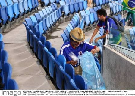 Japan fans (JPN), JUNE 19, 2014 - Football Soccer : Japanese fans pick up trash off the stands after the FIFA World Cup 2014 Group C match at Estadio das Dunas in Natal . Noxthirdxpartyxsales  (pfta006167)