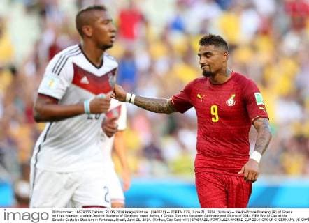 (140621) -- FORTALEZA, June 21, 2014 (Xinhua) -- Kevin-Prince Boateng (R) of Ghana and his younger brother Jerome Boateng of Germany react during a Group G match between Germany and Ghana of 2014 FIFA World Cup at the Estadio Castelao Stadium in Fortaleza, Brazil, June 21, 2014. (Xinhua Cao Can)(wll) (SP)BRAZIL-FORTALEZA-WORLD CUP 2014-GROUP G-GERMANY VS GHANA 