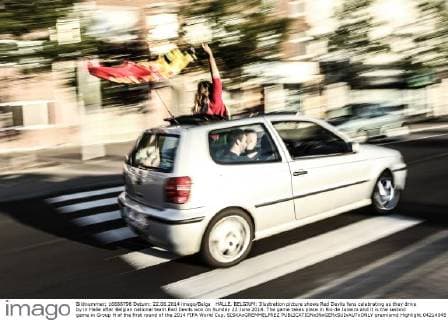 HALLE, BELGIUM: Illustration picture shows Red Devils fans celebrating as they drive by in Halle after Belgian national team Red Devils won on Sunday 22 June 2014. The game takes place in Rio de Janeiro and it is the second game in Group H of the first round of the 2014 FIFA World Cup. SISKAxGREMMELPREZ  premiumd Highlight 04214545