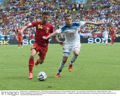 Rio De Janeiro, Brazil - 22 June 2014, Brazil World Cup. Players fight for a ball Russia and Belgium in MaracanÃ¡  - ZUMAp13