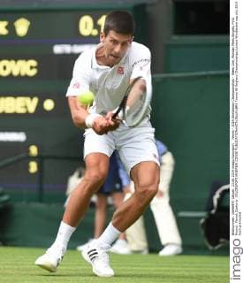 Tennis - 2014 Wimbledon Championships - Week One, Monday Mens Singles, First Round: Novak Djokovic COLORSPORT ANDREW COWIE 