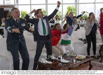 MEXICO CITY, Jun. 23, 2014 - This image provided by Mexico s Presidency on June 23, 2014 shows Mexican President Enrique Pena Nieto (2nd L) and National Defense Secretary Salvador Cienfuegos (1st L) react as they watch the Group A third round match of 2014 FIFA World Cup between Mexico and Croatia in Mexico City, capital of Mexico. 