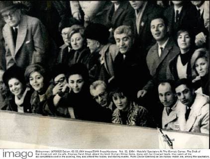 Feb. 02, 1964 - Watchful Spectators At THe Olympic Games: The Shah of Iran Innsbruck with his wife, Empress Farah Dibah attend the Ninth Olympic Winter Game. Along with her Crowned heads. they watch all the ski competitions and in the evening, they also attend the hockey and skating events. Photo Shows Watching an Ice-hockey match are, among the spectators, in the front row Farah Dibah, the Shah of Iran, Anouchka with her flance Karm Aga Kahn. Second Row, extreme-right is Princess Ira De Furstenberg.  - ZUMAk09