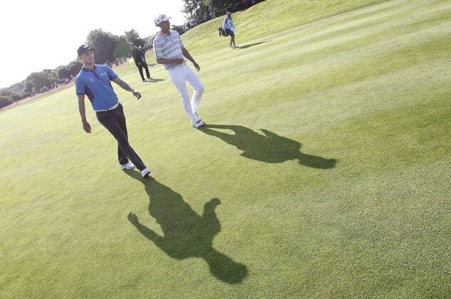 26.06.2014, Pulheim bei Köln: Deutschlands Martin Kaymer (L) und Marcel Siem werfen ihre Schatten voraus beim Golfturnier BMW International Open auf Gut Lärchenhof.
