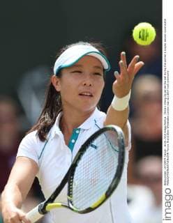 China s Zheng Jie serves the ball during the women s singles second round match 