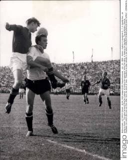 Jun. 26, 1954 - Swiss - Austria in Lausanne 5 : 7: A double foul , as picture shows. The swiss forward Charles Antenen is holding his opponent while the other is keeping his leg tight. The arbitrator Charlie Faultless can watch the one nor the other from his piont of view. Therefore no stop whistle to be heard.  - ZUMAk09