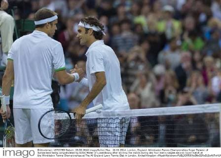 26.06.2014. London, England. Wimbledon Tennis Championships Roger Federer of Switzerland being congratulated by Gilles MÃ¼ller of Luxembourg after winning the match during day four men s singles second round match at the Wimbledon Tennis Championships at The All England Lawn Tennis Club in London, United Kingdom xNigelxWaldronx  ActionPlus11536992