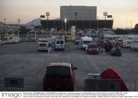 Vehicles are seen at the Sambadrome, in Rio de Janeiro, June 27, 2014. The world famous Sambadrome, where the famous samba parade of annual Carnival take place, were allocated to the supporters and fans of different teams, as an improvised camp site to terminate their camping at Copacabana and Ipanema beaches. 