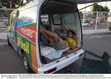 A fan from Colombia rests in his van at the Sambadrome, in Rio de Janeiro, June 27, 2014. The world famous Sambadrome, where the famous samba parade of annual Carnival take place, were allocated to the supporters and fans of different teams, as an improvised camp site to terminate their camping at Copacabana and Ipanema beaches. 