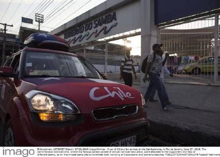 A car of Chile s fan arrives at the Sambadrome, in Rio de Janeiro, June 27, 2014. The world famous Sambadrome, where the famous samba parade of annual Carnival take place, were allocated to the supporters and fans of different teams, as an improvised camp site to terminate their camping at Copacabana and Ipanema beaches. 